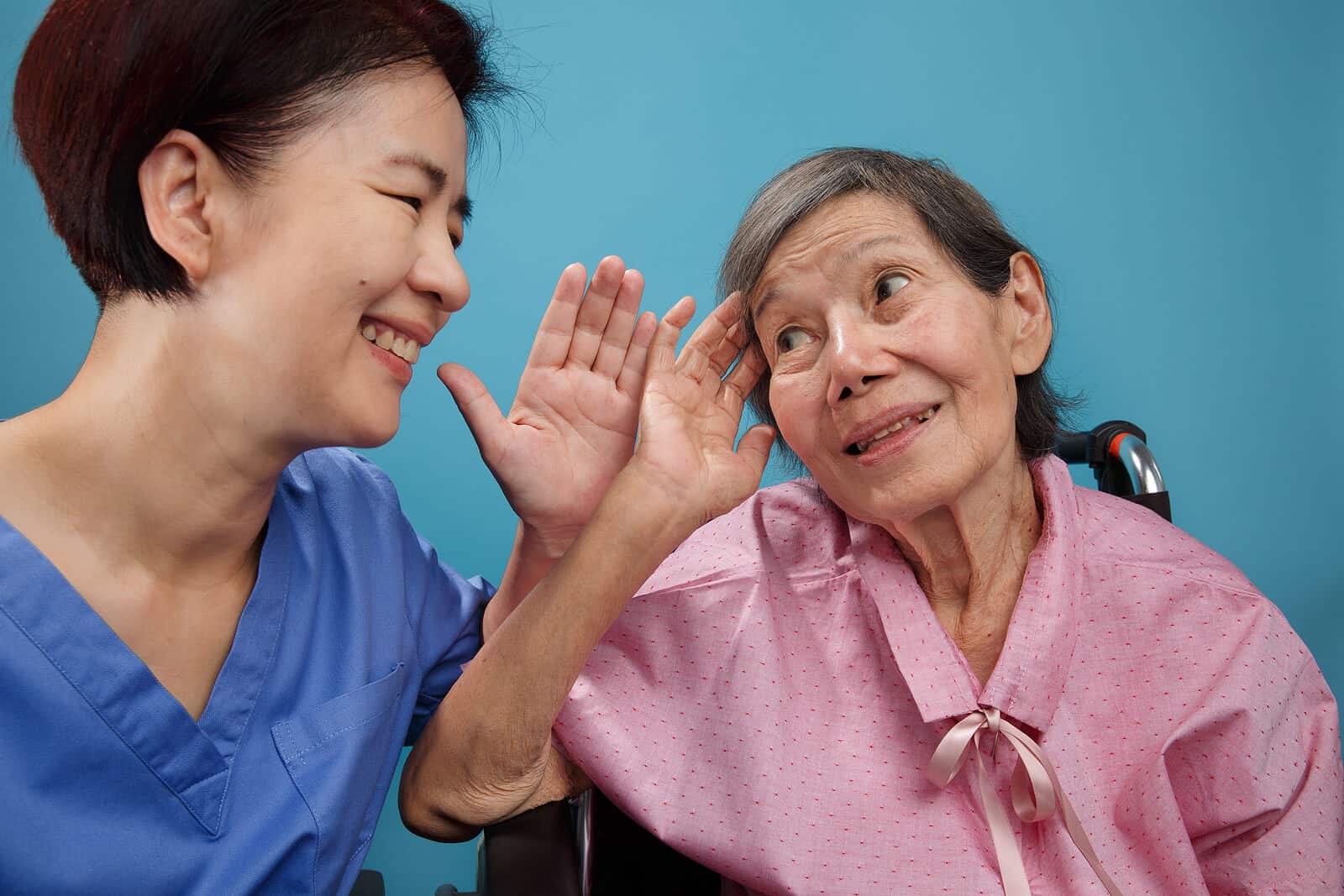 older woman talking to healthcare professional